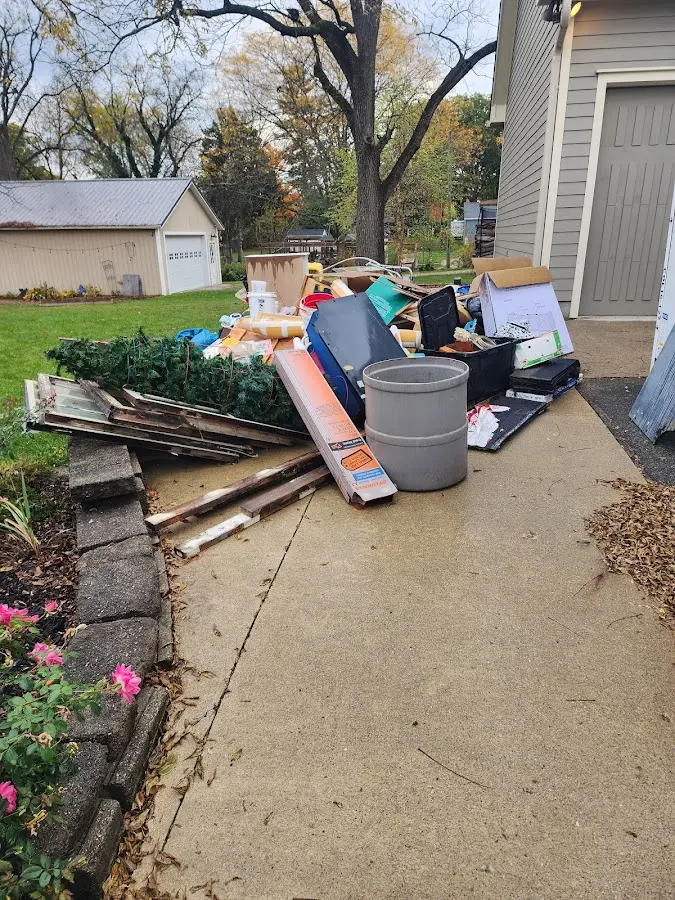 Dumpster being loaded with debris for 10 Yard Dumpster Rental in PiÃÂ±on Hills